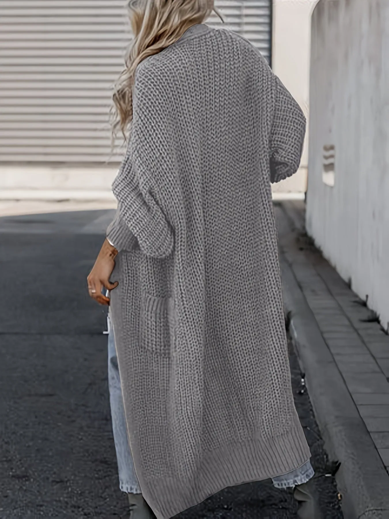 Lang gebreid vest